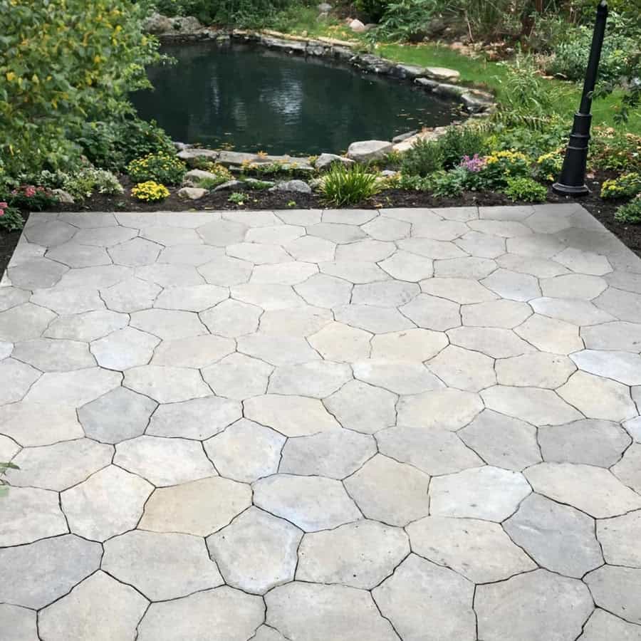 Patio and pond surround installed by hardscape contractor Cornerstone Patio and Wall in Torrington Connecticut serving Northwest CT, Western Massachusetts, and Eastern New York.